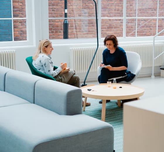 Person sitting with tablet